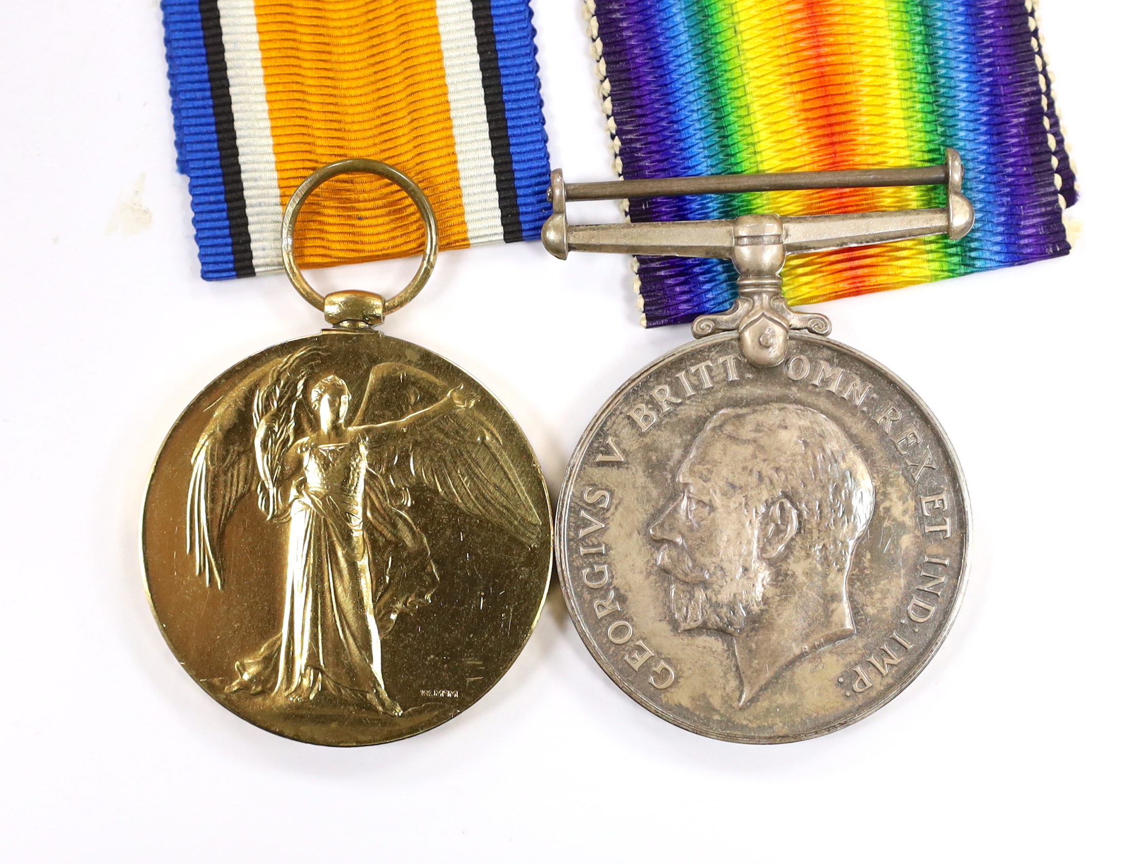 A WWI medal pair of Victory medal and British War medal, to Cpl. J.S. Rhodes A.S.C., with their original card box and outer postal envelope